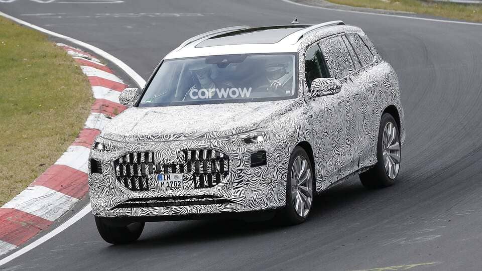 2023 audi q9 suv spy shots side front view