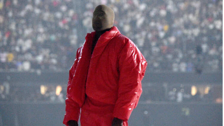 Kanye West Performs in concert dressed in red