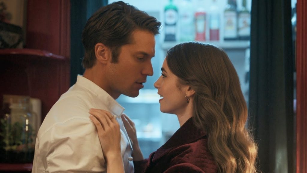 Lucas Bravo as Gabriel and Emily Cooper kiss Netflix series