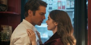 Lucas Bravo as Gabriel and Emily Cooper kiss Netflix series