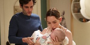 Victoria Pedretti as Love Quinn and Penn Badgley as Joe Goldberg with a baby